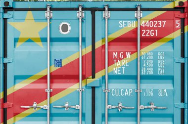 Democratic Republic of the Congo flag depicted on metal doors of shipping cargo container outdoors in docks area close up clipart