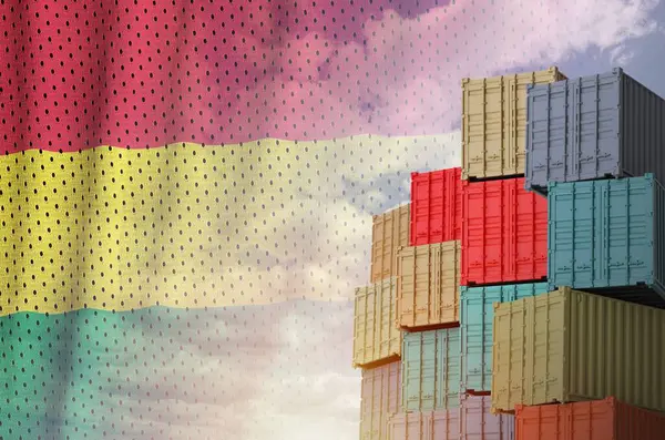 stock image Bolivia flag and big stack of shipping cargo containers in docks with sky background close up