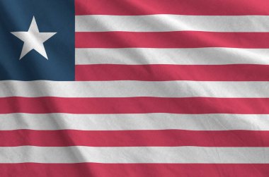 Eski kumaşın kıvrımlı kumaşında Liberya bayrağı tasvir edilmiştir.