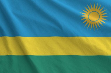 Ruanda bayrağı eski kumaştan katlanmış dalgalı kumaş üzerinde tasvir edilmiştir.