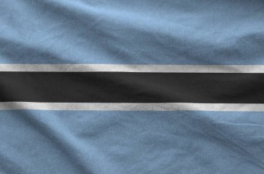 Botsvana bayrağı katlanmış eski kumaşların dalgalı kumaşında tasvir edilmiştir.