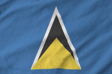 Saint Lucia flag depicted on folded wavy fabric of old cloth close up clipart