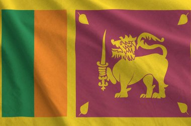 Sri Lanka flag depicted on folded wavy fabric of old cloth close up clipart