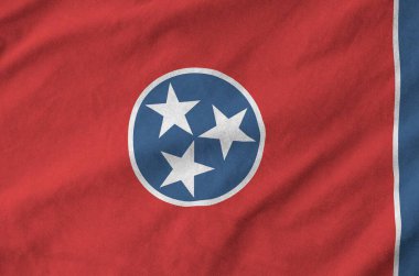 Tennessee US state flag depicted on folded wavy fabric of old cloth close up clipart