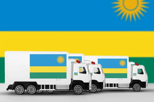 stock image Rwanda flag depicted on side wall of white delivery van close up. Shipping and local delivery concept