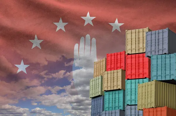 stock image Abkhazia flag and big stack of shipping cargo containers in docks with sky background close up