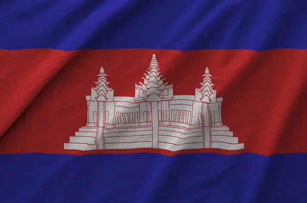 stock image Cambodia flag depicted on folded wavy fabric of old cloth close up