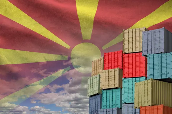 stock image Macedonia flag and big stack of shipping cargo containers in docks with sky background close up