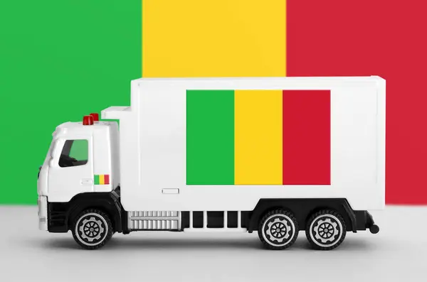 stock image Mali flag depicted on side wall of white delivery van close up. Shipping and local delivery concept