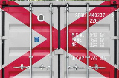 Alabama US state flag depicted on metal doors of shipping cargo container outdoors in docks area close up clipart