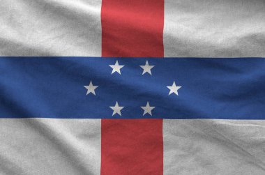Hollanda Antilleri bayrağı eski kumaşın katlanmış dalgalı kumaşında tasvir edilmiştir.