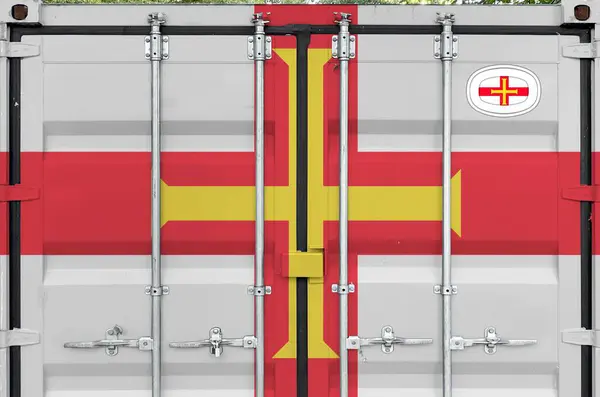 Stock image Guernsey flag depicted on metal doors of shipping cargo container outdoors in docks area close up