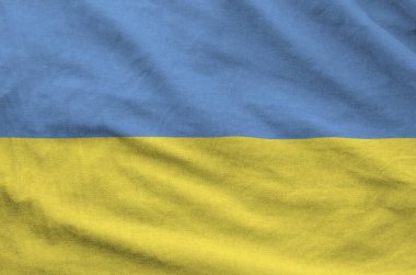 Ukrayna bayrağı eski kumaşların kıvrımlı kumaşında tasvir edilmiştir.