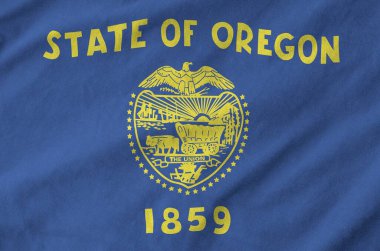 Oregon Amerikan bayrağı eski kumaştan katlanmış dalgalı kumaş üzerine çizilmiş.