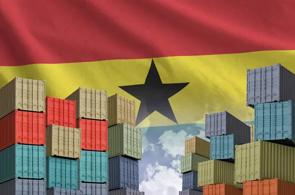 stock image Ghana flag and big stack of shipping cargo containers in docks with sky background close up