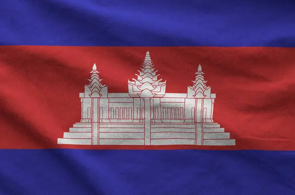 stock image Cambodia flag depicted on folded wavy fabric of old cloth close up