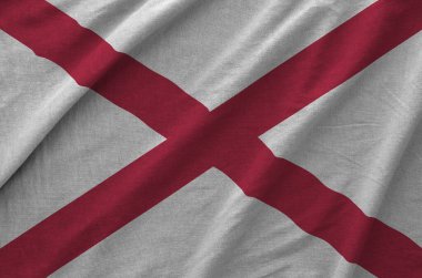 Alabama Birleşik Devletleri bayrağı eski kumaştan katlanmış dalgalı kumaş üzerinde tasvir edilmiştir.