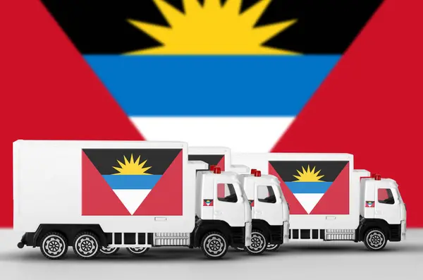 stock image Antigua and Barbuda flag depicted on side wall of white delivery van close up. Shipping and local delivery concept