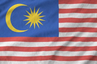 Malaysia flag depicted on folded wavy fabric of old cloth close up clipart