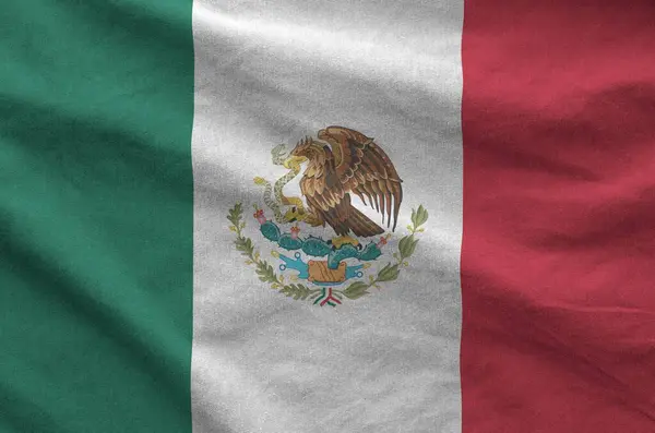 stock image Mexico flag depicted on folded wavy fabric of old cloth close up