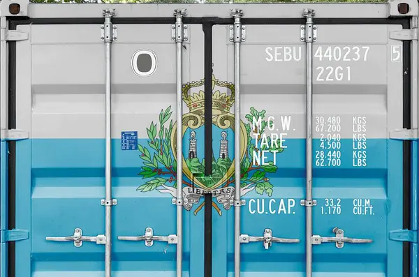 stock image San Marino flag depicted on metal doors of shipping cargo container outdoors in docks area close up