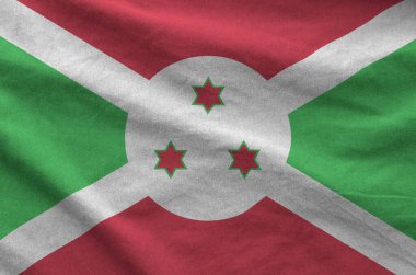 Burundi bayrağı eski kumaşın kıvrımlı kumaşında tasvir edilmiştir.