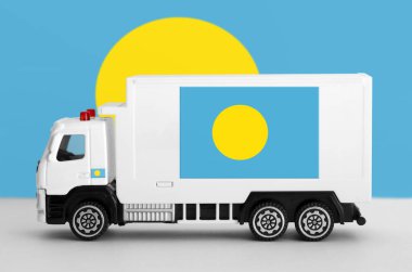 Palau flag depicted on side wall of white delivery van close up. Shipping and local delivery concept clipart