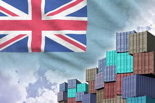 stock image Tuvalu flag and big stack of shipping cargo containers in docks with sky background close up