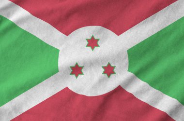 Burundi bayrağı eski kumaşın kıvrımlı kumaşında tasvir edilmiştir.