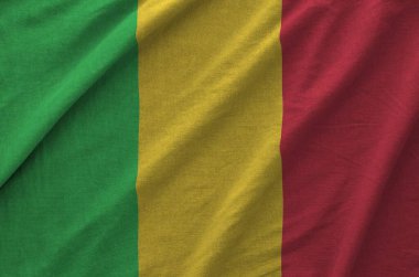 Mali flag depicted on folded wavy fabric of old cloth close up clipart