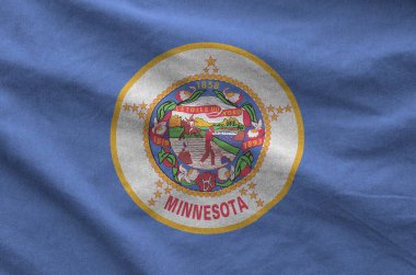 Minnesota ABD bayrağı eski kumaşların katlanmış dalgalı kumaşında tasvir edilmiştir.