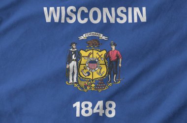 Wisconsin US state flag depicted on folded wavy fabric of old cloth close up clipart