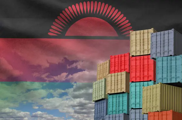 stock image Malawi flag and big stack of shipping cargo containers in docks with sky background close up