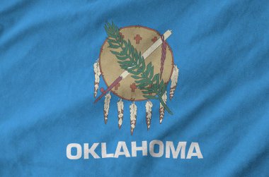 Oklahoma ABD bayrağı eski kumaşların kıvrımlı kumaşında tasvir edilmiştir.