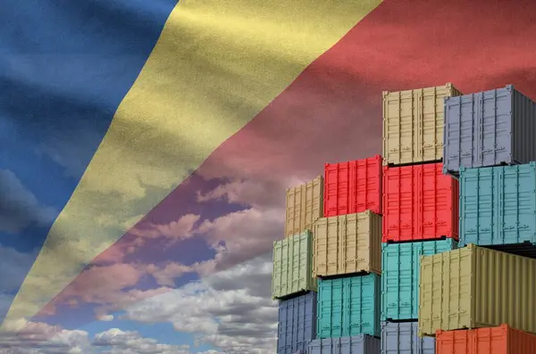 stock image Seychelles flag and big stack of shipping cargo containers in docks with sky background close up