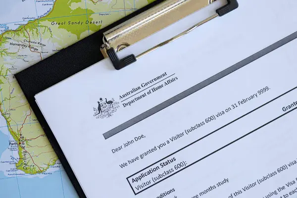 stock image KYIV, UKRAINE - JULY 10, 2024 Application status for Australian visitor visa on table of Australian Government Department of Home Affairs close up