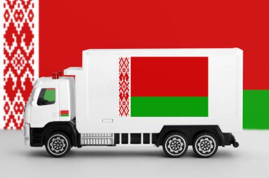 Belarus flag depicted on side wall of white delivery van close up. Shipping and local delivery concept clipart