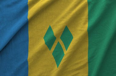 Aziz Vincent ve Grenadines bayrağı eski kumaşın katlanmış dalgalı kumaşında resmedilmiş.