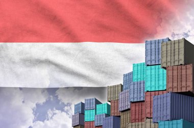 Yemen flag and big stack of shipping cargo containers in docks with sky background close up clipart