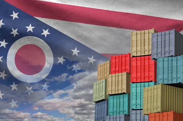 stock image Ohio US state flag and big stack of shipping cargo containers in docks with sky background close up