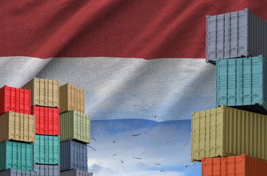 Netherlands flag and big stack of shipping cargo containers in docks with sky background close up clipart