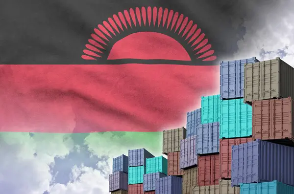 stock image Malawi flag and big stack of shipping cargo containers in docks with sky background close up