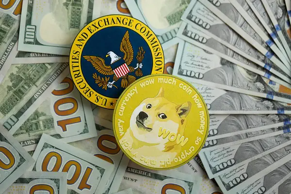 stock image KYIV, UKRAINE - AUGUST 17, 2024 DOGE Meme coin and US Securities and Exchange Commission sign on money background close up