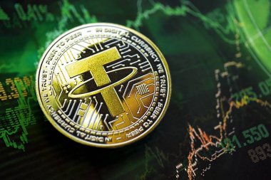 KYIV, UKRAINE - AUGUST 17, 2024 Tether USDT coin on dark cryptocurrency digital trading chart in green colors close up clipart