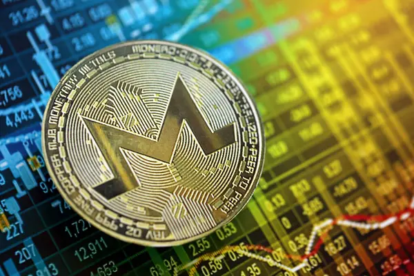 Stock image KYIV, UKRAINE - AUGUST 17, 2024 Monero XMR coin on cryptocurrency trading chart with calculations in different colors close up