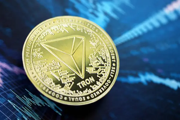 stock image KYIV, UKRAINE - AUGUST 17, 2024 TRON Coin on abstract fictional cryptocurrency trading chart in blue color close up