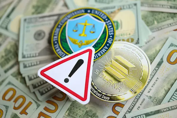 stock image KYIV, UKRAINE - AUGUST 17, 2024 Solana SOL coin and US Federal Trade Commission sign on many USD dollar money bills close up