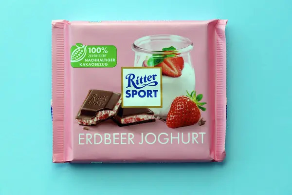 stock image KYIV, UKRAINE - AUGUST 17, 2024 Ritter Sport logotype on small chocolate bar in wrapping close up