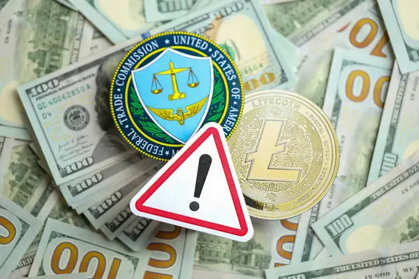 stock image KYIV, UKRAINE - AUGUST 17, 2024 Litecoin LTC coin and US Federal Trade Commission sign on many USD dollar money bills close up