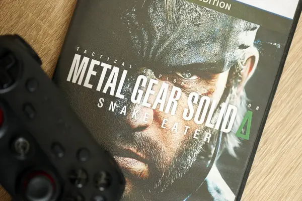 stock image KYIV, UKRAINE - JUNE 26, 2024 Metal Gear Solid Delta Snake Eater PS5 video game disc box for console gaming. Popular video game disc close up